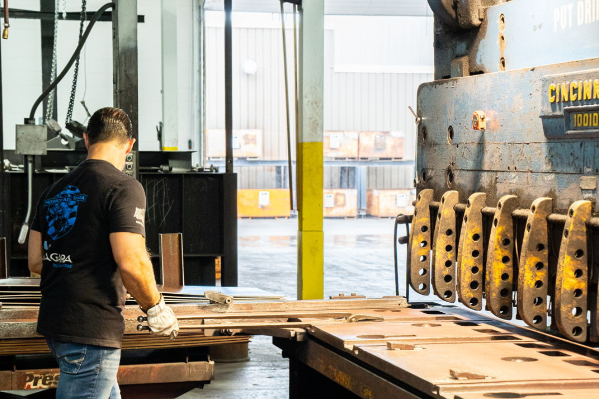Niagara Specialty Metals sheet mill operator working at the sheer, showcasing the Erasteel Niagara partnership in precision rolling and finishing