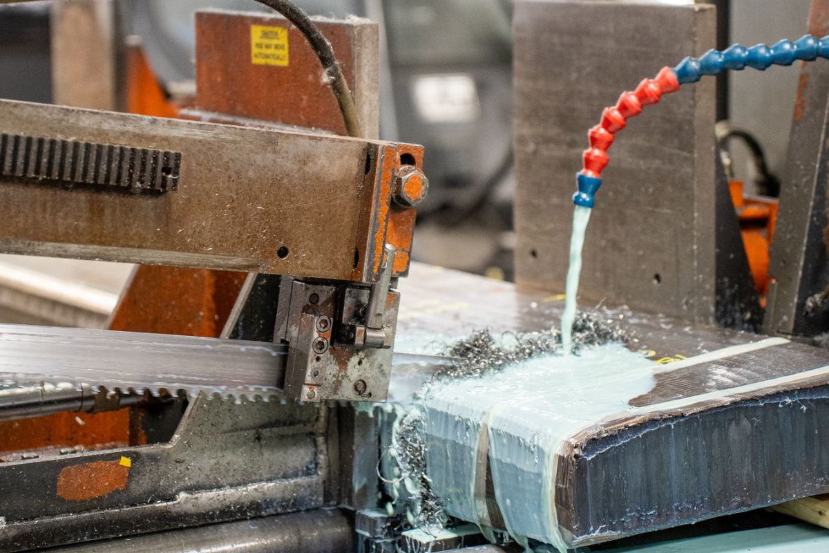 Billet cutting in action at Niagara Specialty Metals, supporting the history of Chris Reeve Knives through precision steel processing