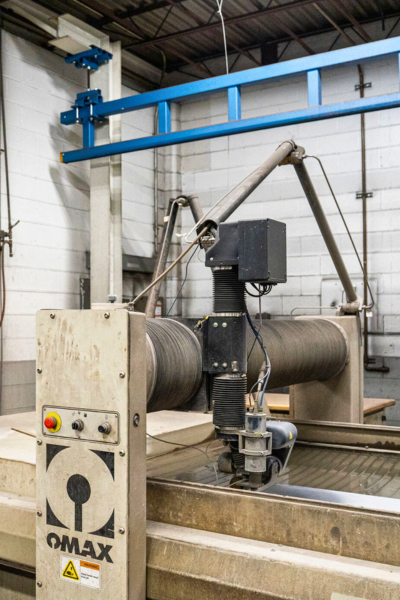 OMAX water jet machine at Niagara Specialty Metals supporting precision cutting and long-term success in knife retail through reliable steel processing