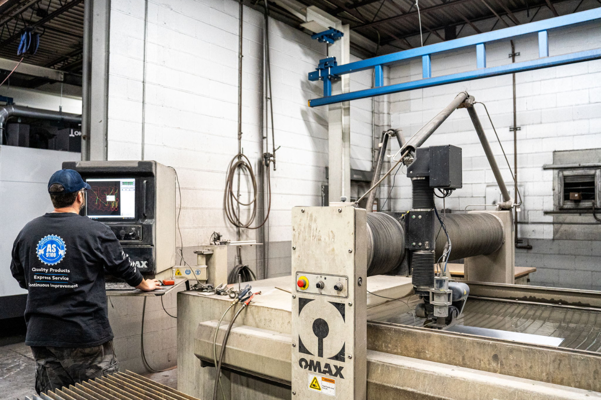 OMAX water jet machine at Niagara Specialty Metals supporting precision cutting and long-term success in knife retail through reliable steel processing