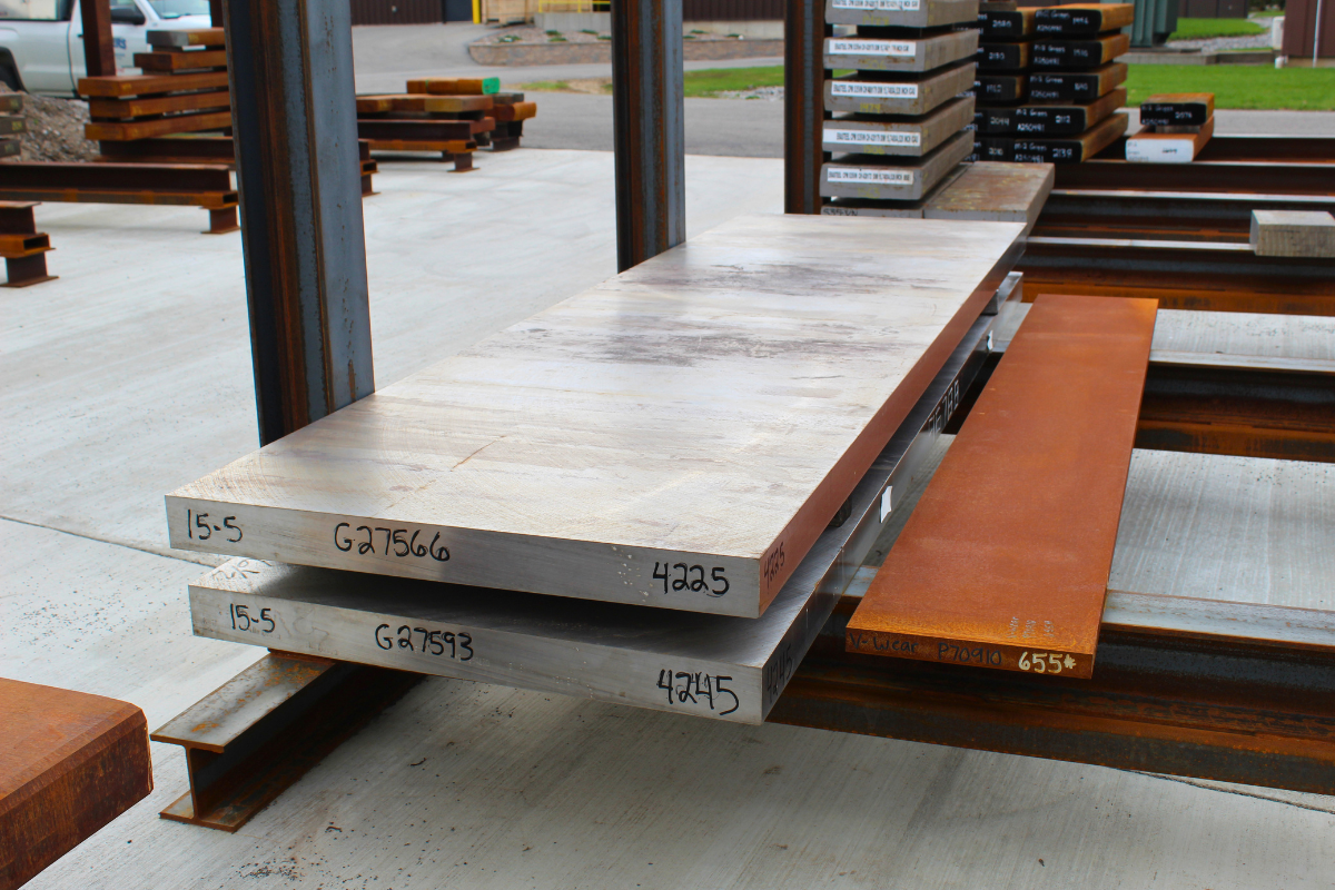 Certified maraging steel for aerospace production alongside 15-5PH aerospace steel billet in Niagara Specialty Metals billet yard