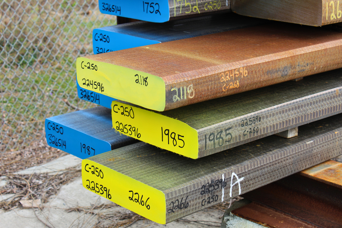 Maraging steel C250 properties shown through C250 billets stored in Niagara Specialty Metals billet yard for aerospace and defense processing