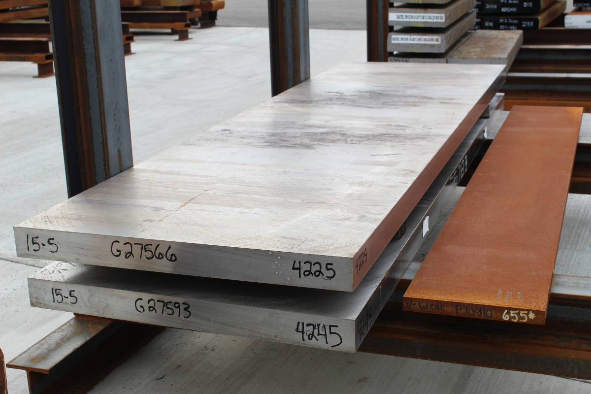 Custom maraging steel supplier inventory featuring 15-5PH aerospace steel billet in Niagara Specialty Metals billet yard for precision processing