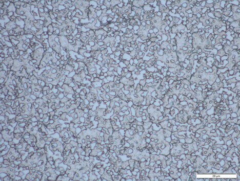 Microscope image of M390 carbide structure showing larger chromium carbides that can reduce toughness compared to MagnaMax.