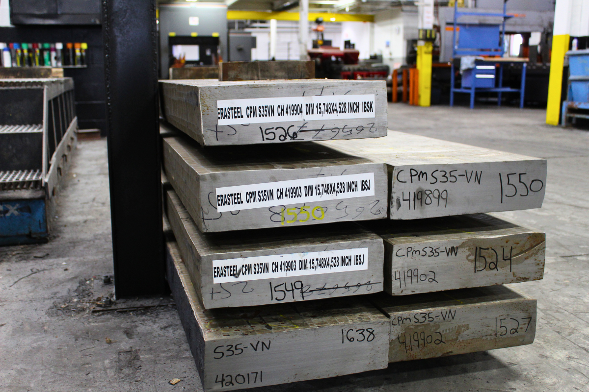 Erasteel S35VN stainless steel billets stored inside the Niagara Specialty Metals facility prior to processing and heat treatment