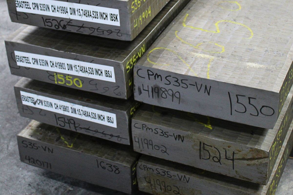 Close-up of Erasteel S35VN stainless steel billets at Niagara Specialty Metals for knife manufacturing applications