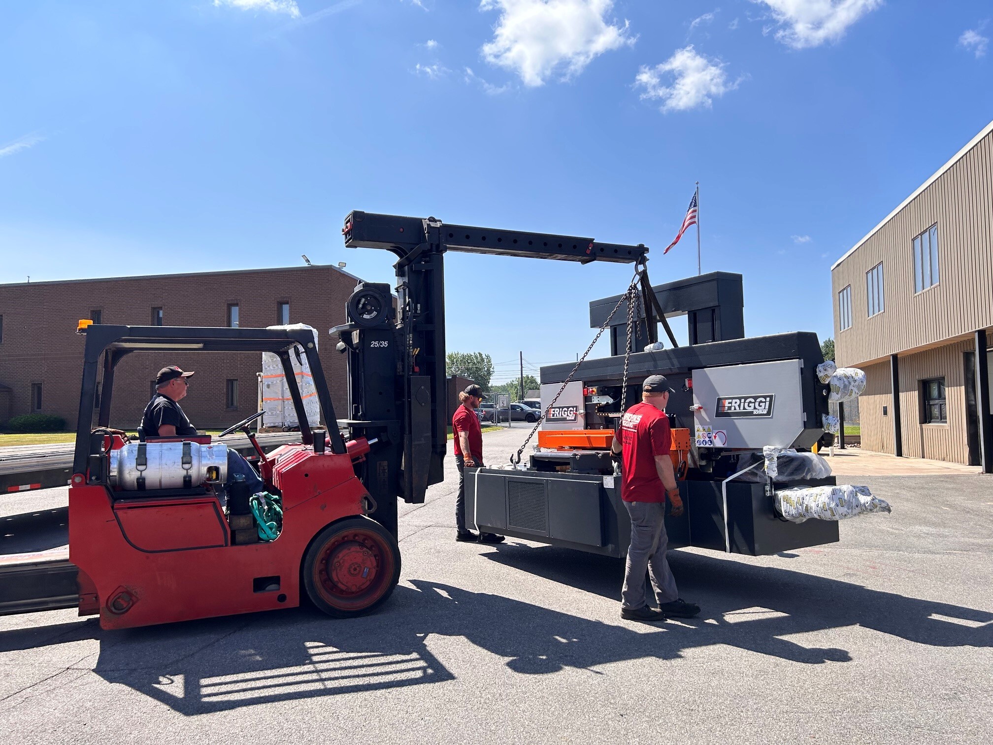 New production saw being transported into the Niagara Specialty Metals facility during installation