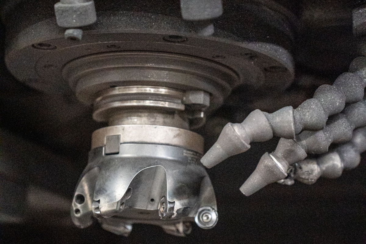 Close-up of the Mattison grinding machine at Niagara Specialty Metals supporting precision finishing and steel performance testing standards