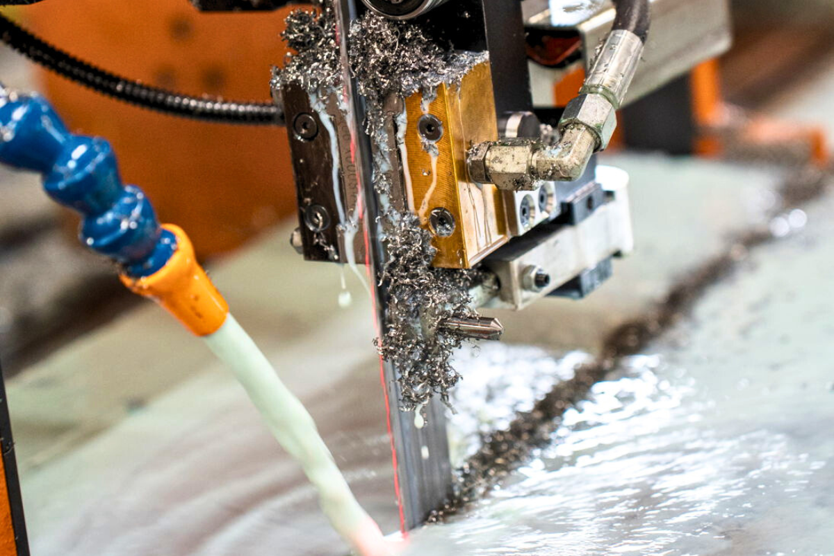 Vertical saw cutting Erasteel powder metallurgy steels at Niagara Specialty Metals for precision sizing and high-performance applications
