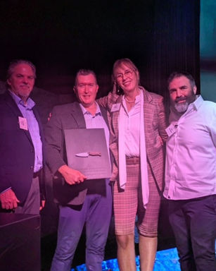 SHOT Show 2026 recap image of Benchmade leadership team presenting Supplier of the Year awards to Niagara Specialty Metals.