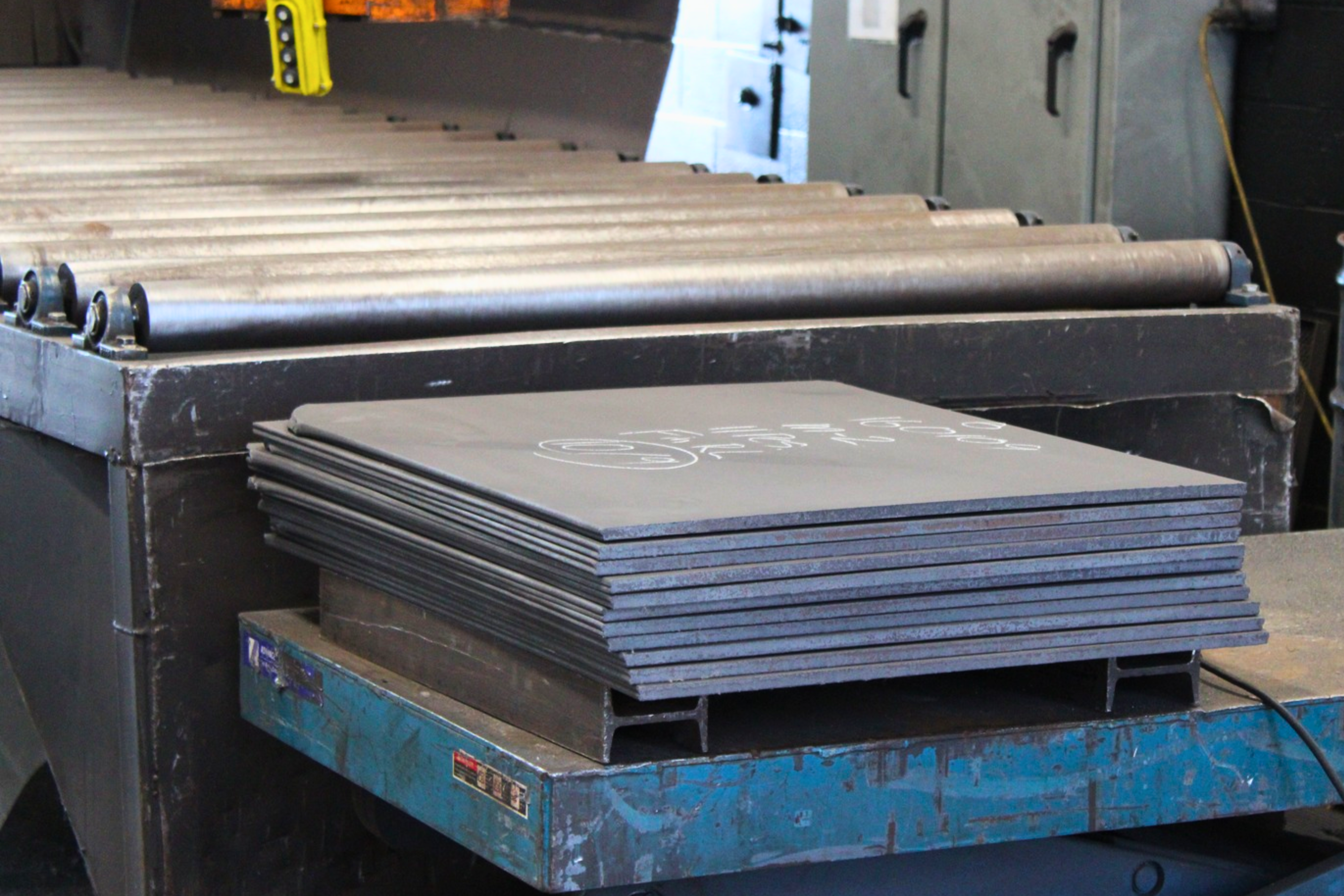 Shot blasting at Niagara Specialty Metals showing cleaned specialty metal plates prepared for additional processing