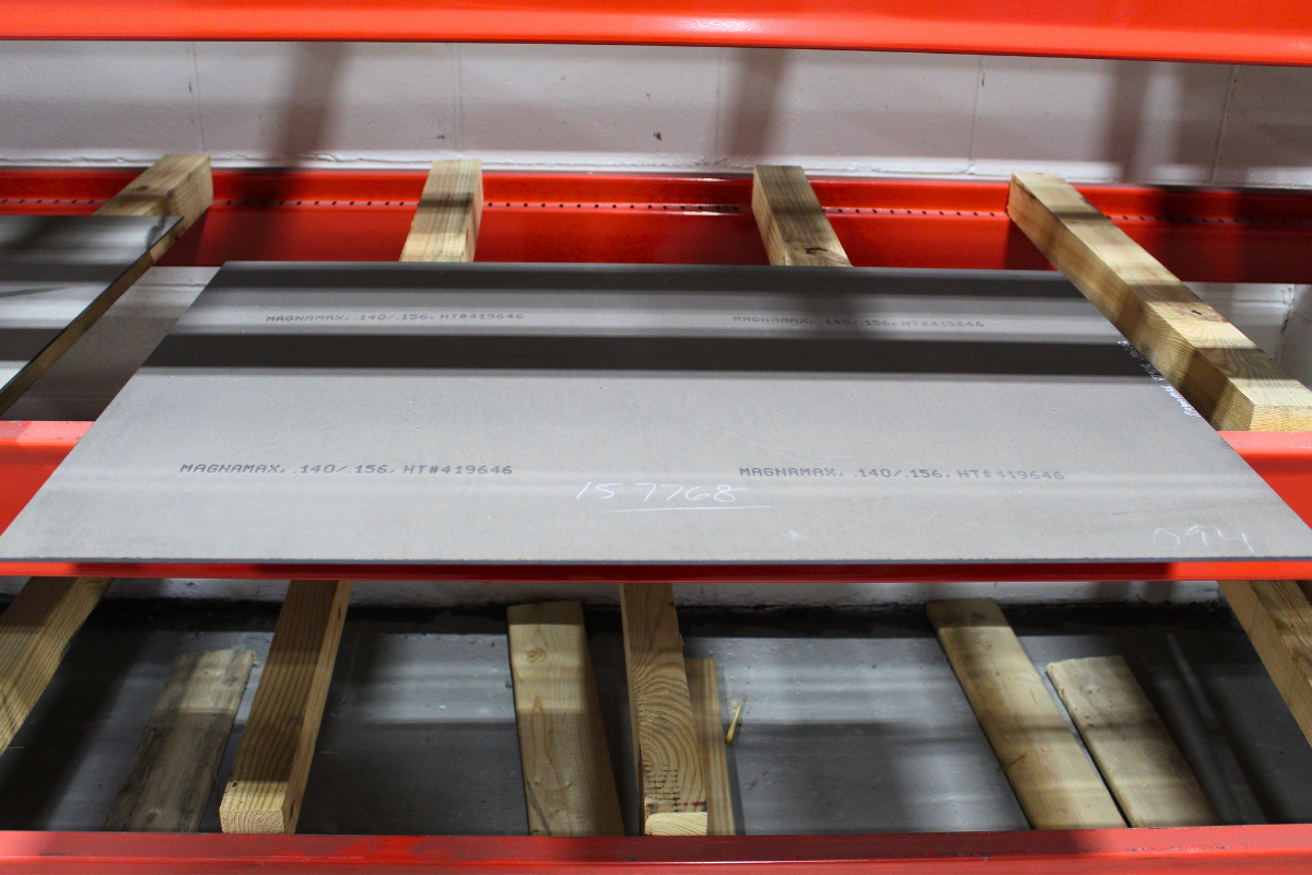 Finished MagnaMax&trade; sheet in the Niagara Specialty Metals warehouse showcasing MagnaMax steel performance for high edge retention knife applications. 